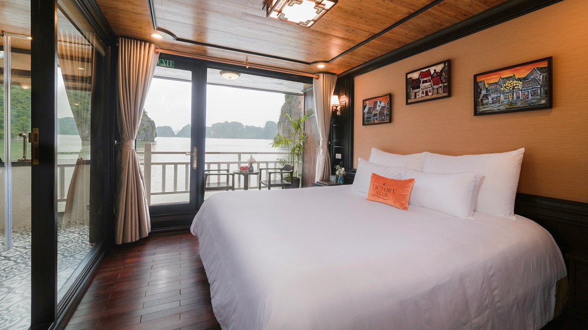 Deluxe Balcony cabin aboard Victory Star Cruise